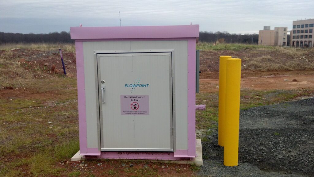 A purple automated bulk water reclamation station